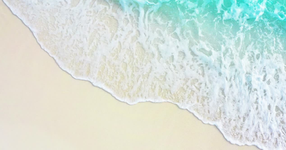 A picture of beach waves on the sand.