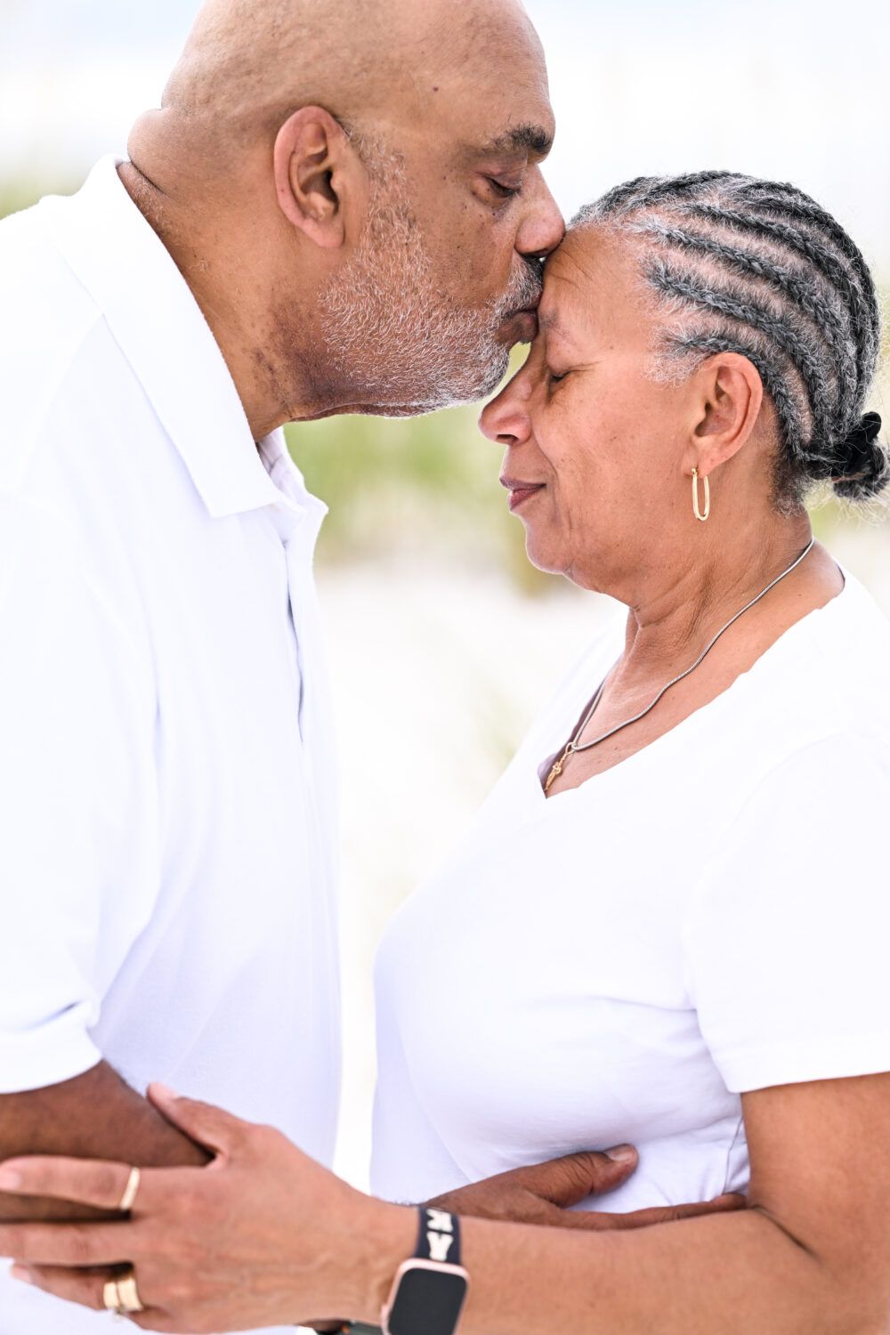 Close-up of grandparents holding hands